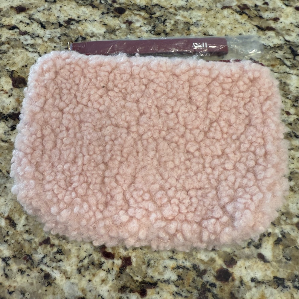 Ipsy light pink fuzzy mini bag
